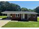 Charming brick ranch home with a well-manicured lawn and a covered carport at 907 Mcgowan Rd, Shelby, NC 28150