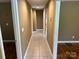Hallway with tile floor leading to bedrooms at 907 Mcgowan Rd, Shelby, NC 28150