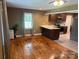 Inviting living room connected to the kitchen with beautiful hardwood floors and ample natural light at 907 Mcgowan Rd, Shelby, NC 28150