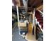 Basement view featuring a stairwell, exposed ductwork, and storage area at 910 Mcgowan Rd, Shelby, NC 28150