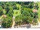 Expansive property featuring mature trees, open green space, and outbuildings at 10230 Hagers Rd, Huntersville, NC 28078