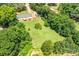Expansive backyard featuring mature trees and an open lawn, perfect for outdoor activities and enjoying the natural surroundings at 10230 Hagers Rd, Huntersville, NC 28078