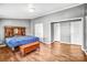 Relaxing bedroom featuring hardwood floors and plenty of closet space, designed for comfort and peaceful living at 10230 Hagers Rd, Huntersville, NC 28078