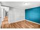 Spacious bedroom featuring wood-look floors and neutral paint at 10230 Hagers Rd, Huntersville, NC 28078
