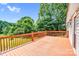 Large wooden deck with railing and backyard view at 10230 Hagers Rd, Huntersville, NC 28078