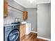 Laundry room featuring a washer, dryer and plenty of storage at 10230 Hagers Rd, Huntersville, NC 28078