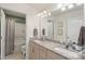Bathroom featuring double sinks, granite countertops, and a shower-tub combo at 108 Wrangler Dr, Mooresville, NC 28115