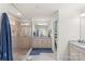 Modern bathroom boasts a glass-enclosed shower and double vanity with granite countertops at 108 Wrangler Dr, Mooresville, NC 28115