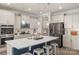 Bright kitchen with a center island, white countertops, stainless steel appliances, and pendant lighting at 108 Wrangler Dr, Mooresville, NC 28115
