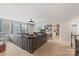 Spacious living room with large couch, big window, and a view of the staircase for a bright and comfortable space at 108 Wrangler Dr, Mooresville, NC 28115