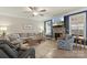 Comfortable living room with fireplace, large sectional sofa, and natural light at 108 Wrangler Dr, Mooresville, NC 28115