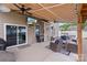 Relaxing outdoor patio with ceiling fans, a tv, and a view of the backyard at 108 Wrangler Dr, Mooresville, NC 28115