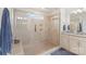 Luxurious tiled shower with glass enclosure and a built-in bench for added comfort at 108 Wrangler Dr, Mooresville, NC 28115
