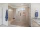 Beautifully tiled shower with a glass door and a convenient built-in bench at 108 Wrangler Dr, Mooresville, NC 28115
