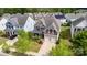 Overhead shot of a well-maintained two-story home with a manicured lawn and a two-car garage in a residential area at 11014 Aspen Ridge Nw Ln, Concord, NC 28027