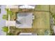 Overhead view of a house featuring a gray roof, well-maintained yard, and mature landscaping at 11014 Aspen Ridge Nw Ln, Concord, NC 28027