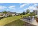 Beautiful backyard with a large grassy area and a patio with outdoor seating at 11014 Aspen Ridge Nw Ln, Concord, NC 28027