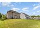 Spacious backyard with a well-maintained lawn and fence, offering privacy and security at 11014 Aspen Ridge Nw Ln, Concord, NC 28027