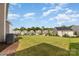 Expansive backyard with well-maintained lawn and view of neighboring homes in a suburban community at 11014 Aspen Ridge Nw Ln, Concord, NC 28027