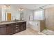 This bathroom features a granite vanity, tub, and separate tiled shower with glass doors at 11014 Aspen Ridge Nw Ln, Concord, NC 28027