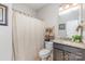 This bathroom features a granite vanity, a toilet, and a shower with a curtain at 11014 Aspen Ridge Nw Ln, Concord, NC 28027