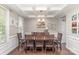 Elegant dining room featuring a coffered ceiling and a large wooden table with seating for eight at 11014 Aspen Ridge Nw Ln, Concord, NC 28027