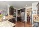Modern kitchen with stainless steel appliances, granite countertops, and dark wood cabinets at 11014 Aspen Ridge Nw Ln, Concord, NC 28027