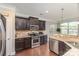 Spacious kitchen featuring stainless steel appliances, ample cabinetry, and a breakfast bar at 11014 Aspen Ridge Nw Ln, Concord, NC 28027