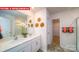 Stylish bathroom with double sinks, vanity, and decorative wall accents at 11128 Cardinal Creek Ave, Charlotte, NC 28215