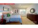 Bright bedroom with an orange metal frame bed, neutral carpet, and playful decor at 11128 Cardinal Creek Ave, Charlotte, NC 28215