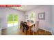 Bright dining area with a wood table, slider access to the yard, and a large window for lots of light at 11128 Cardinal Creek Ave, Charlotte, NC 28215