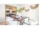 Stylish dining room featuring a modern table setting, decorative wall art, and sophisticated lighting at 11128 Cardinal Creek Ave, Charlotte, NC 28215