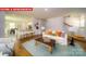 Open-concept living area with hardwood floors, a staircase, and a breakfast bar at 11128 Cardinal Creek Ave, Charlotte, NC 28215