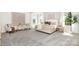 Spacious main bedroom offers a plush bed, soft colors, and plenty of natural light with stylish decor at 11128 Cardinal Creek Ave, Charlotte, NC 28215