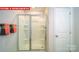 Enclosed shower with glass sliding doors, and built-in shelving at 11128 Cardinal Creek Ave, Charlotte, NC 28215