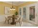 Cozy breakfast nook with a table, chairs, chandelier, and doors to the backyard at 1142 Ardwyck Pl # 5, Rock Hill, SC 29730