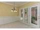 Cozy breakfast nook with tiled floors, a chandelier, and natural light from backyard access at 1142 Ardwyck Pl # 5, Rock Hill, SC 29730