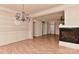 Elegant dining room featuring a fireplace, chandelier, and connection to the bright living room at 1142 Ardwyck Pl # 5, Rock Hill, SC 29730