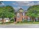 Beautiful brick home with manicured landscaping and mature trees on a sunny day at 1142 Ardwyck Pl # 5, Rock Hill, SC 29730