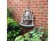 Elegant outdoor lion head fountain feature against a brick wall at 1142 Ardwyck Pl # 5, Rock Hill, SC 29730