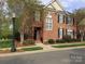 Charming brick townhome featuring a well-maintained yard and elegant architectural details at 1142 Ardwyck Pl # 5, Rock Hill, SC 29730