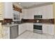 Well-lit kitchen features stainless steel appliances, tile backsplash, granite counters, and light tile flooring at 1142 Ardwyck Pl # 5, Rock Hill, SC 29730