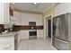 Spacious kitchen offers stainless steel appliances, ample cabinet space, granite counters, and tile flooring at 1142 Ardwyck Pl # 5, Rock Hill, SC 29730