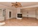 Spacious living room with fireplace, light wood floors, and a ceiling fan for comfort at 1142 Ardwyck Pl # 5, Rock Hill, SC 29730