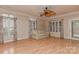 Spacious living room with hardwood floors, large windows, and a ceiling fan for added comfort at 1142 Ardwyck Pl # 5, Rock Hill, SC 29730