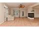 Bright and airy living room with light wood floors, fireplace, and a ceiling fan for added comfort at 1142 Ardwyck Pl # 5, Rock Hill, SC 29730