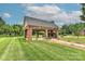 Outdoor pavilion with fireplace, seating, and lush green lawn at 1142 Ardwyck Pl # 5, Rock Hill, SC 29730