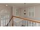Bright staircase with railing and wrought iron chandelier at 1142 Ardwyck Pl # 5, Rock Hill, SC 29730
