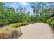 Outdoor living space with brick patio overlooking a manicured lawn at 115 Forestcliff Ne Ct, Concord, NC 28025