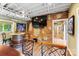 Entertaining basement space featuring wine barrel table and wall-mounted TV at 115 Forestcliff Ne Ct, Concord, NC 28025